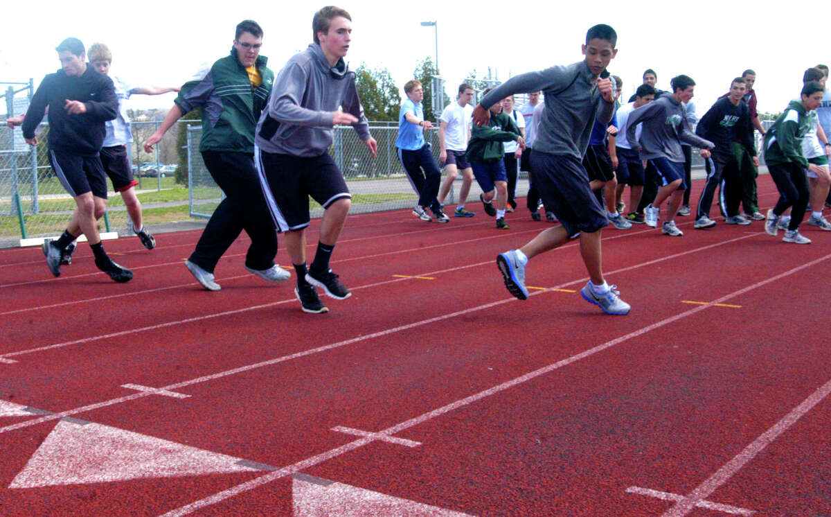 SPECTRUM/Green Wave hopefuls experience agility drills while readying for for the New Milford High School boys' track season, April, 2012