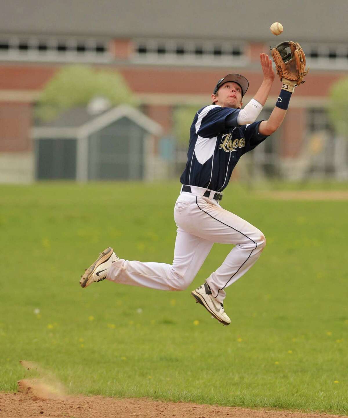 Notre Dame Fairfield second baseman Erik Laaksonen leaps to make a catch during their game against New Milford at New Milford High School on Wednesday, April 18, 2012. New Milford won 10-6.