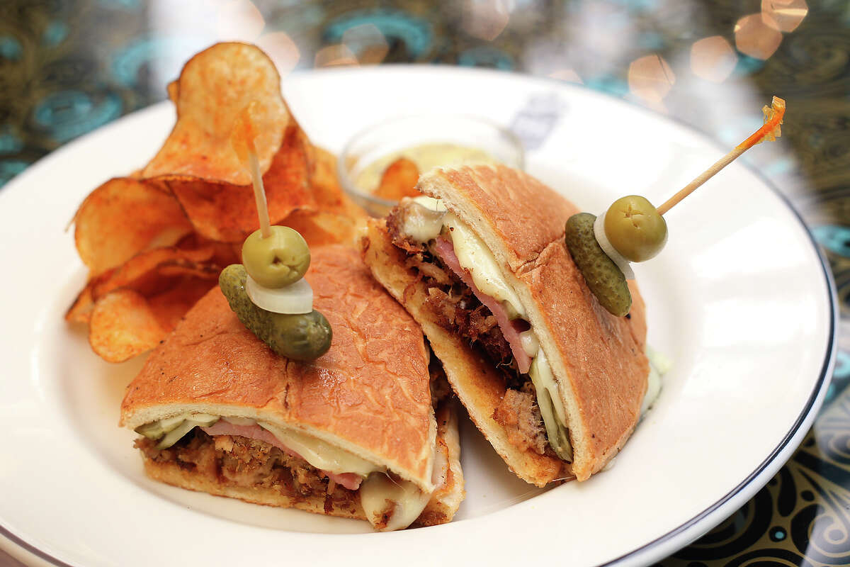 The Havana Cubano from Ocho at Hotel Havana on Wednesday, Apr. 18, 2012. The hot-pressed sandwich is stuffed with slow-roasted pork shoulder seasoned with orange juice, achiote paste, griddled ham and Swiss cheese. Kin Man Hui/Express-News.