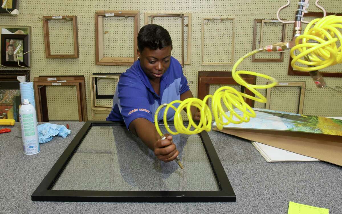 Rachel Dixon prepares a frame in the Hobby Lobby framing department.