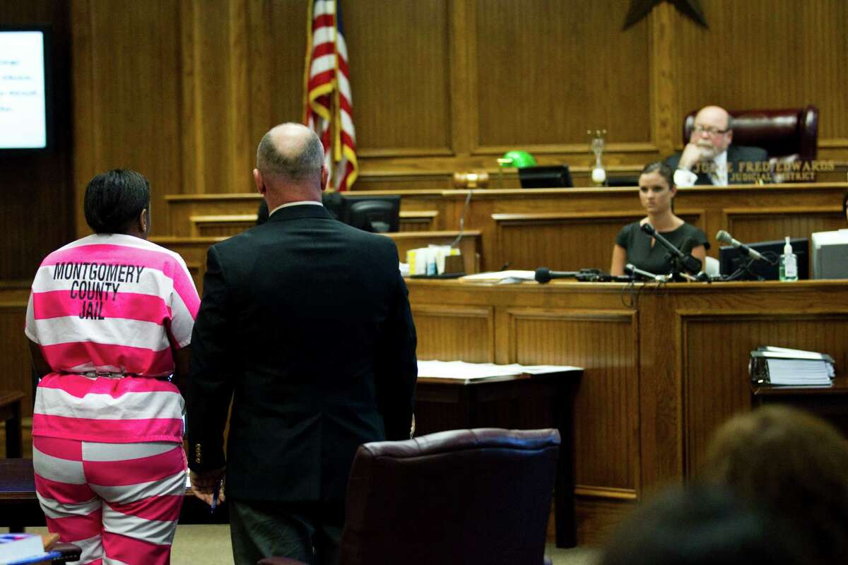 Verna McClain, left, stands with her court-appointed attorney, Tay Bond, before Judge Fred Edwards in the 9th District Criminal Court Thursday, April 19, 2012, in Conroe. McClain is accused of fatally shooting Kala Golden Schuchardt to death Tuesday evening in the parking lot of Northwoods Pediatric Center in Spring, before placing the woman's 3-day-old infant Keegan Schuchardt in her car and speeding off.