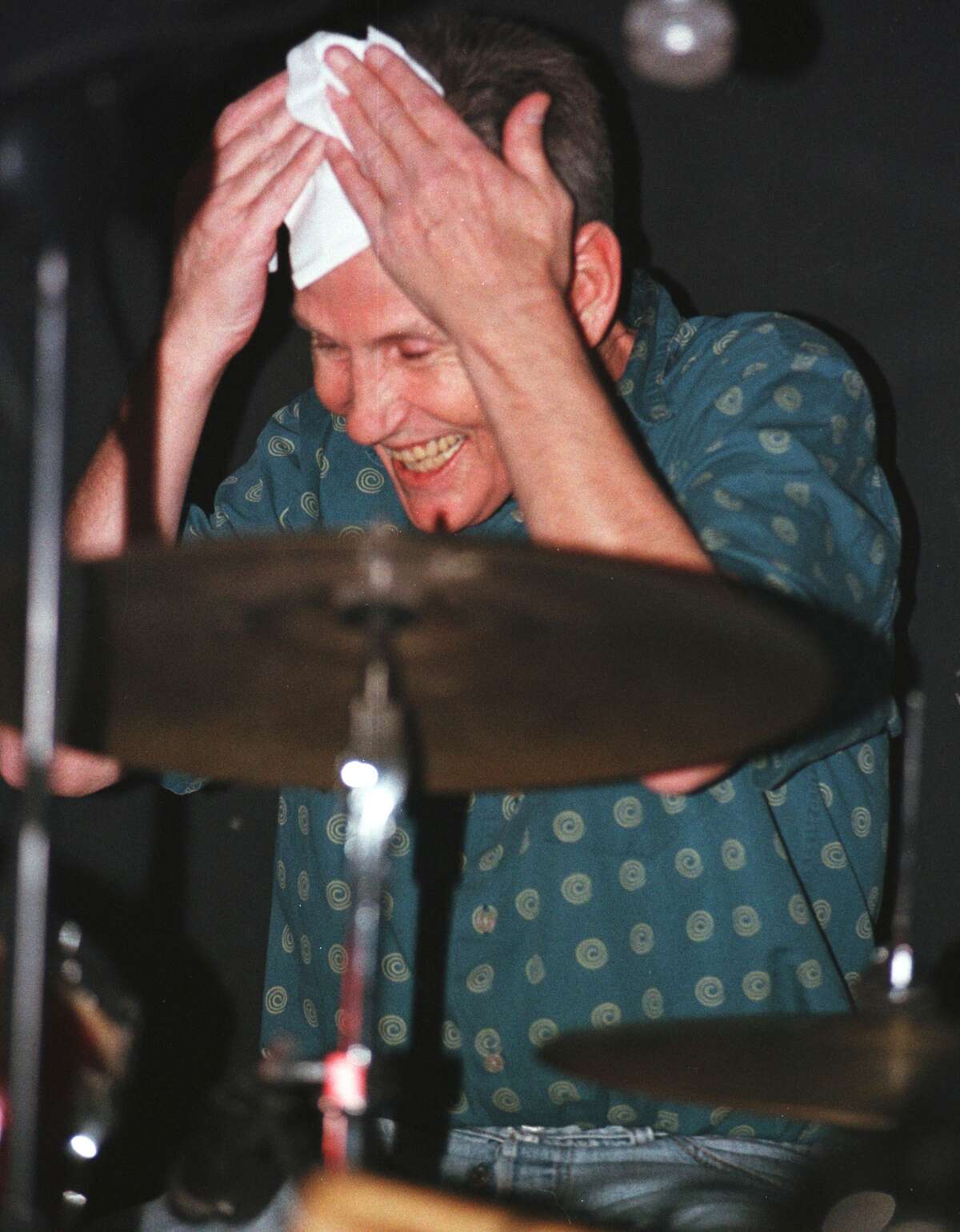 Special to the Times Union by Will Waldron. -- December 29 1999 -- Levon Helm famed The 'Band drummer' wipes a sweaty brow while performing with his new group the 'Barn Burners' during a performance at Joyous Lake Nightclub in Woodstock.