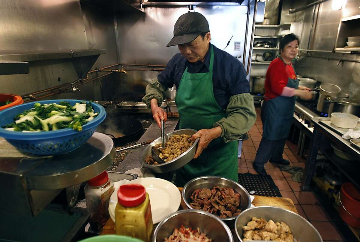 Sen Ren Situ cooks up a lunch order in the cramped kitchen of Chinatown's legendary Sam Wo restaurant in San Francisco, Calif. on Thursday, April 19, 2012. The restaurant's owner is closing its doors for good on Friday.