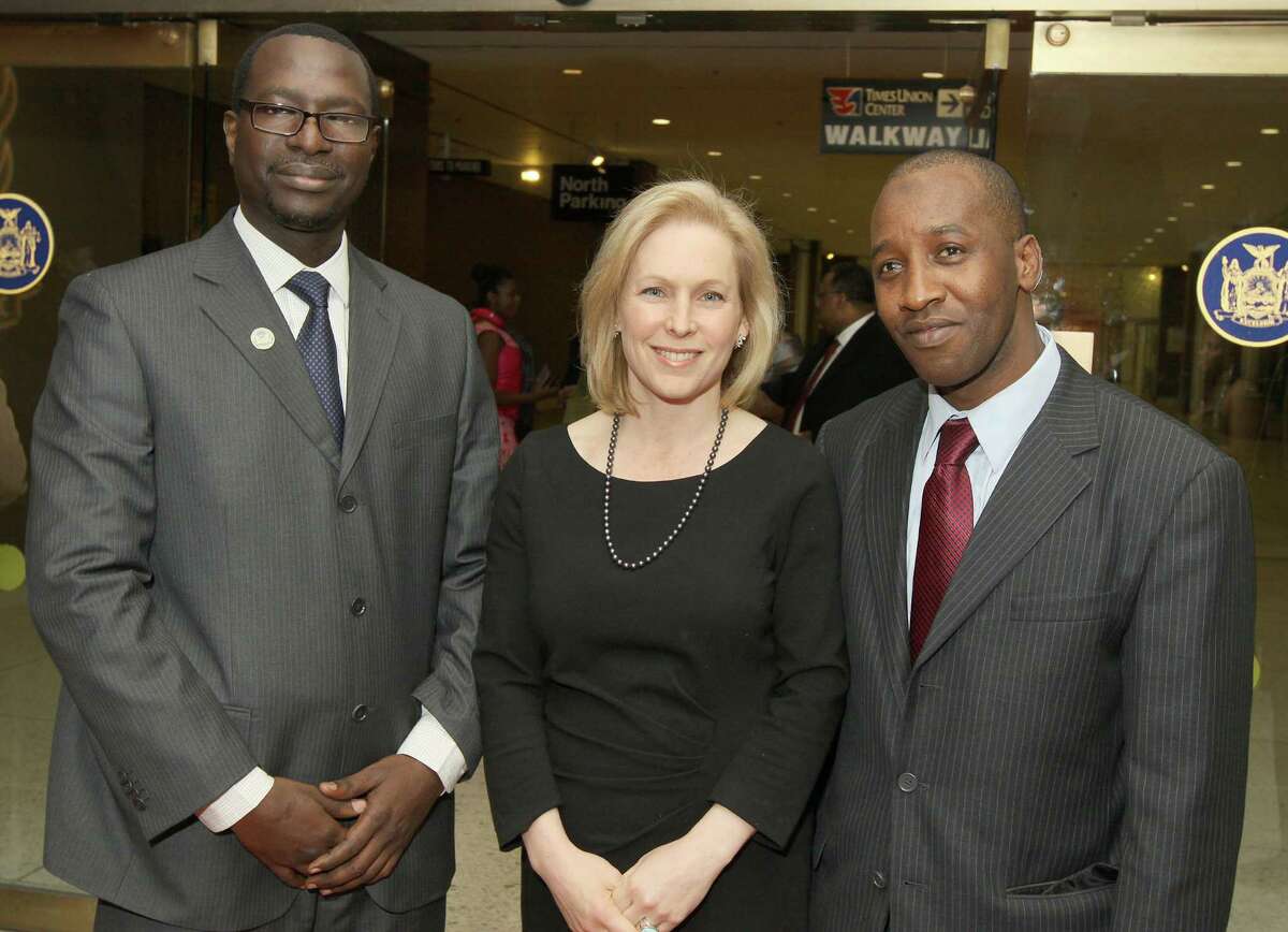 Albany, NY - February 19, 2012 - (Photo by Joe Putrock/Special to the Times Union) - US Senator Kirsten Gillibrand(center) poses with Ali Mbodj(left) and Ahmadou Diallo(right) during the NYS Black & Puerto Rican Caucus gala.