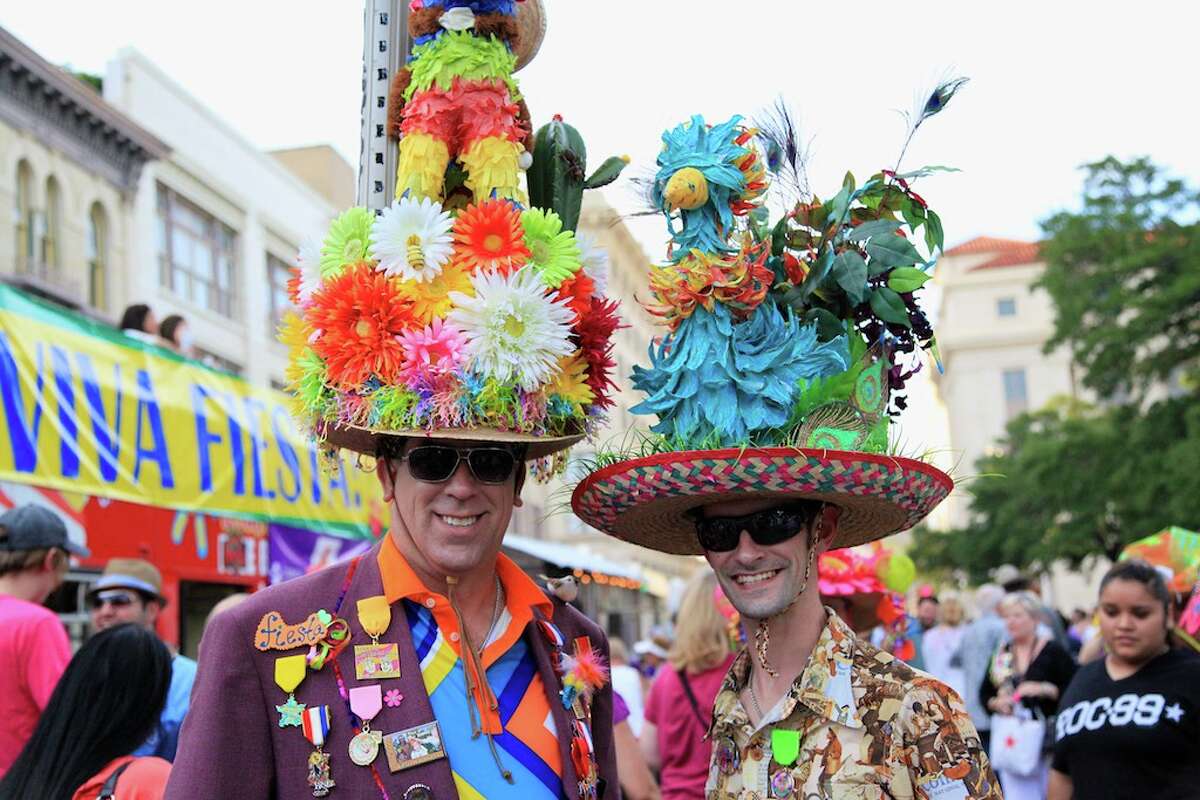 Towering hats, pins on parade mark Fiesta's kickoff