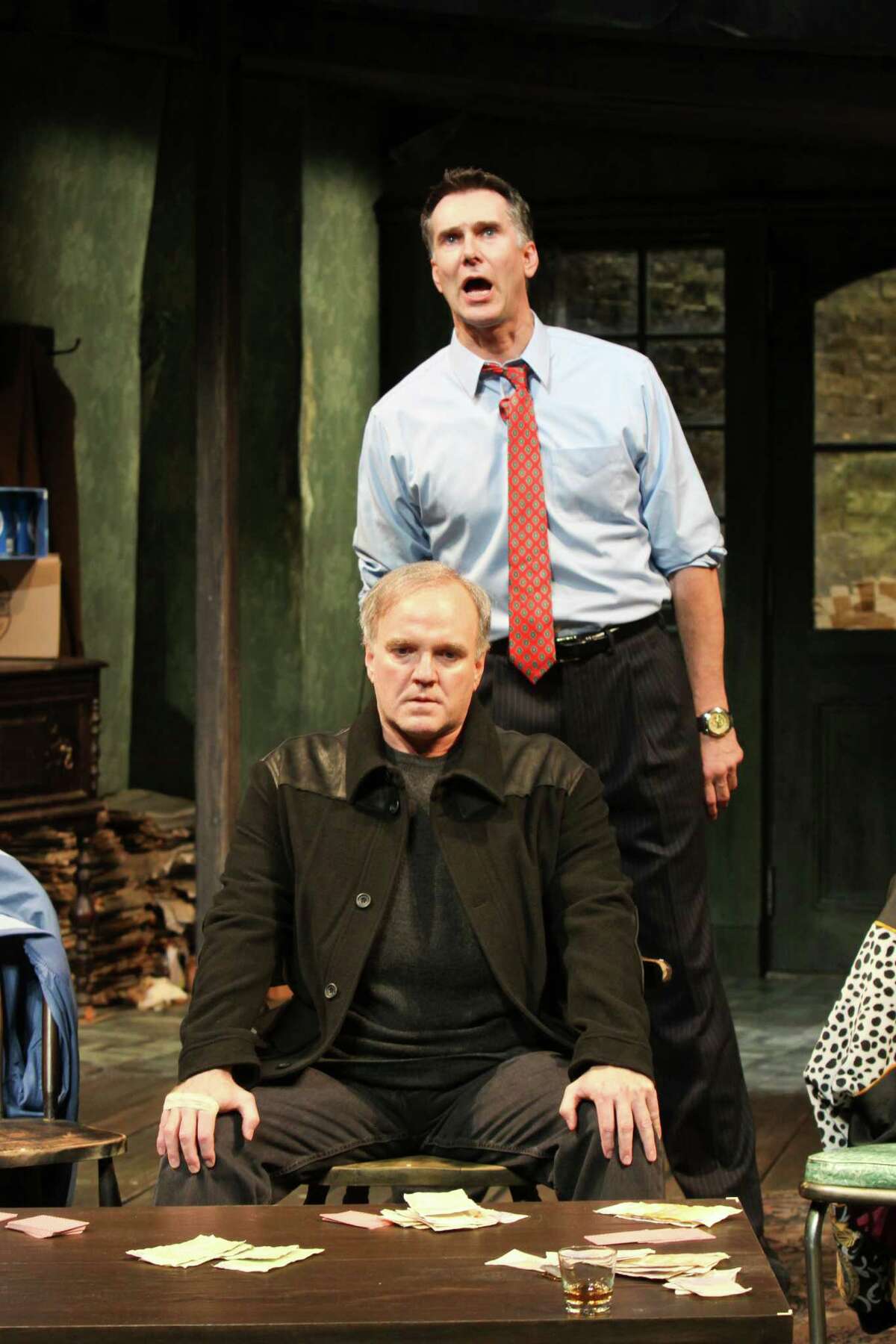 James Black, seated, plays James "Sharky" Harkin and Todd Waite is Mr. Lockhart in Alley Theatre's Houston premiere of Conor McPherson's "The Seafarer."