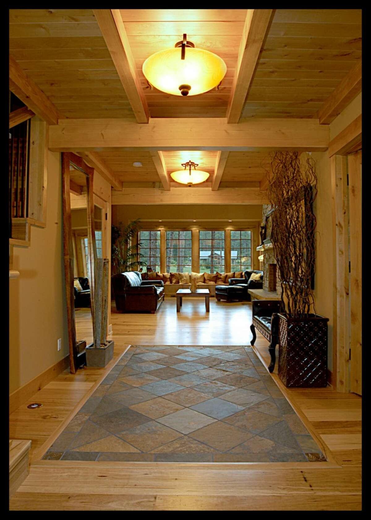 Entry of 741 Maple Leaf Loop, in Suncadia resort. The 3,823-square-foot home has four bedrooms, four bathrooms, wood ceilings with exposed beams, a two-story living room with a huge stone fireplace, a wine cellar, media room/office, reading loft, a two-car garage, patios and decks on a 0.41-acre lot at the 13th hole of Prospector Golf Course. And it has top-level 5-star certification under the Built Green green building program. It's listed for $1.25 million.