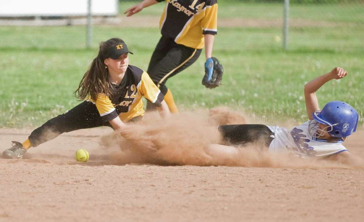 Kaynor Tech shortstop Eduarda Pages has the ball knocked loose at second by Abbott Tech runner Tayla Heunerberg during a game played at Hatters Park. Friday, April 20, 2012