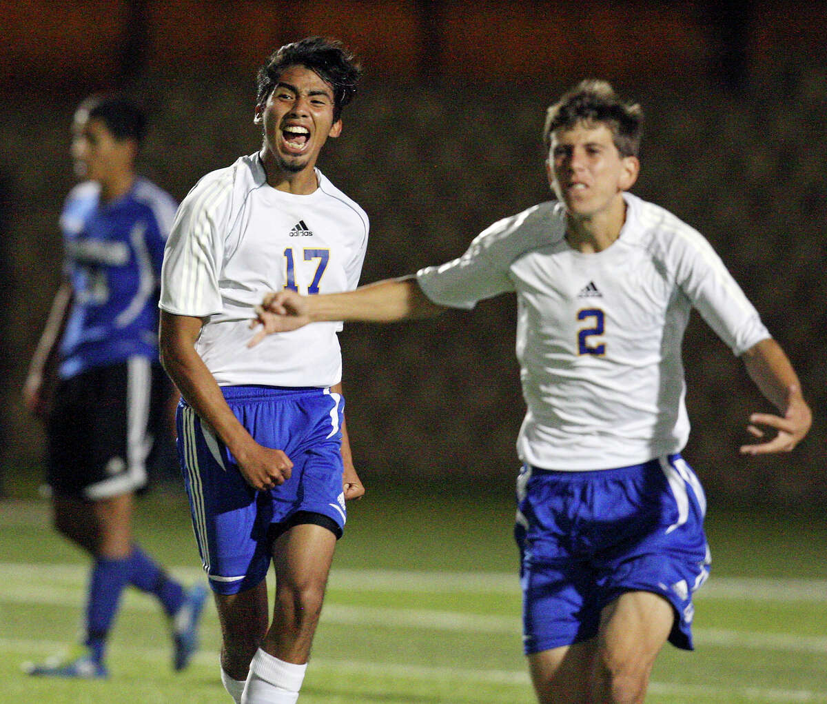 Alamo Heights' Diego Hernandez (left) and teammate Joey Ortega celebrate their 1-0 win over Friendswood in the Class 4A state semifinal game held Friday April 20, 2012 at Birkelbach Field in Georgetown, Tx.