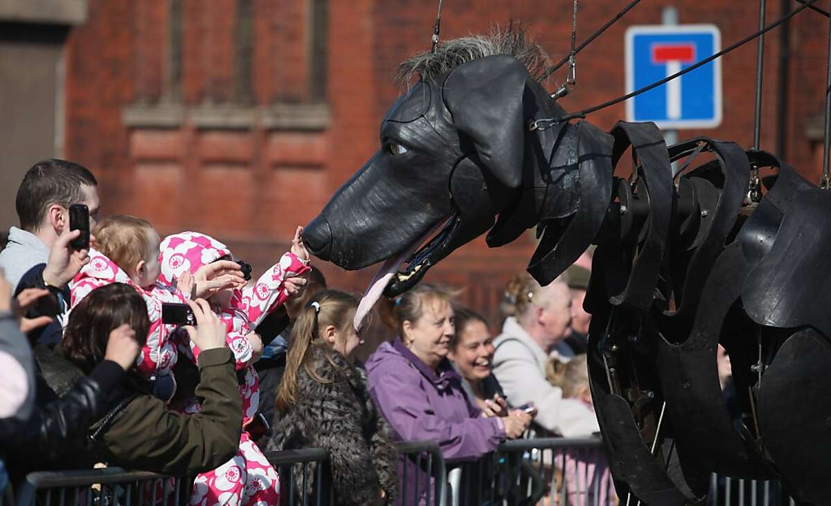 Giant puppets roam streets of Liverpool