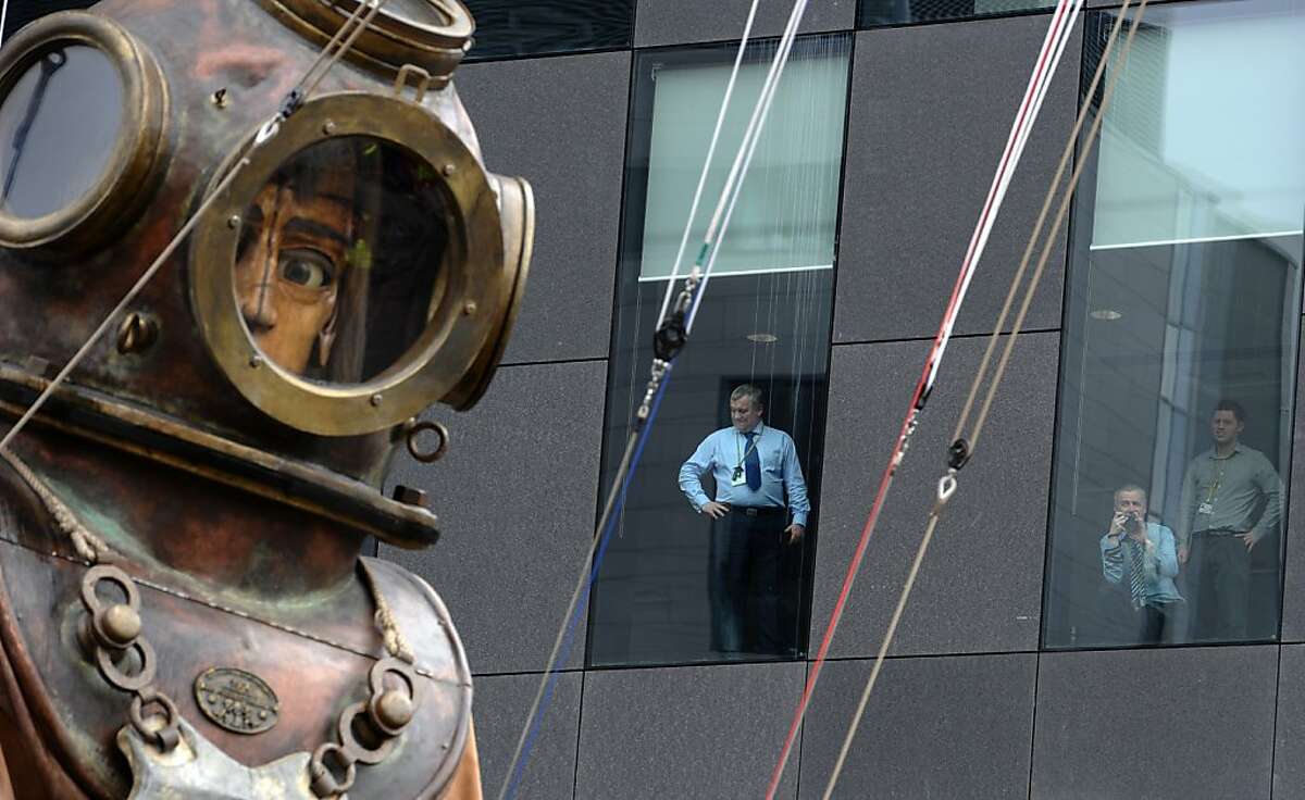 Giant puppets roam streets of Liverpool