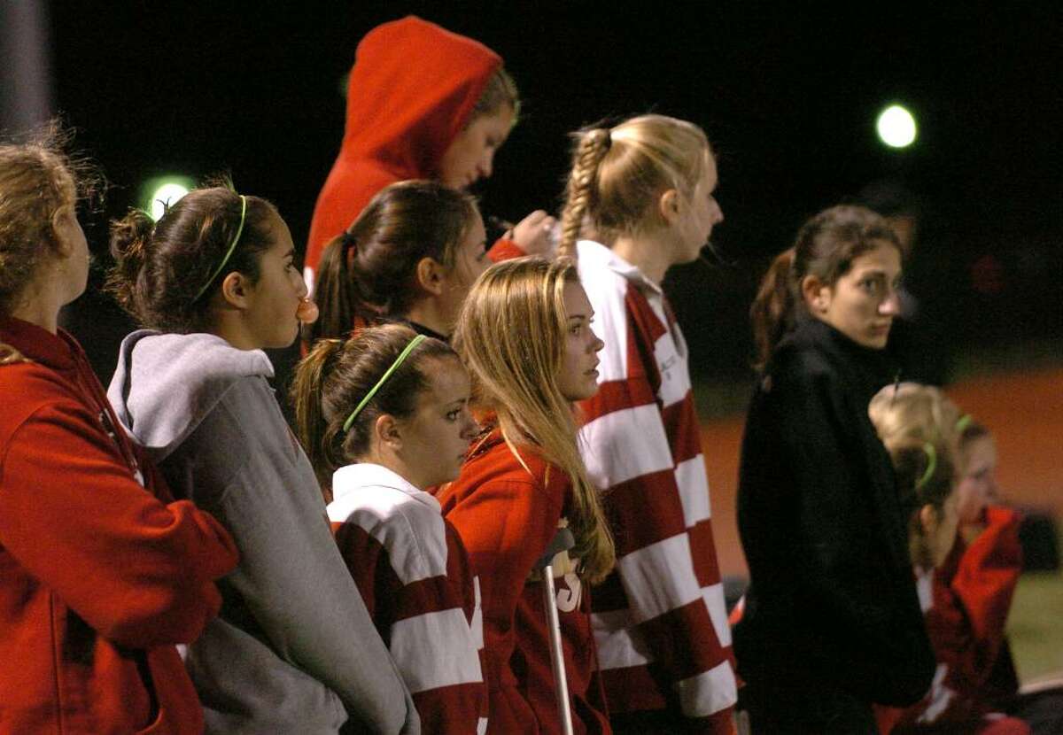 Masuk teammates on the sidelines watch as the final seconds run out, during Class L Semifinals against New Canaan, in Fairfield, Conn. on Wednesday Nov. 18, 2009. Masuk was defeated by New Canaan 3-0.