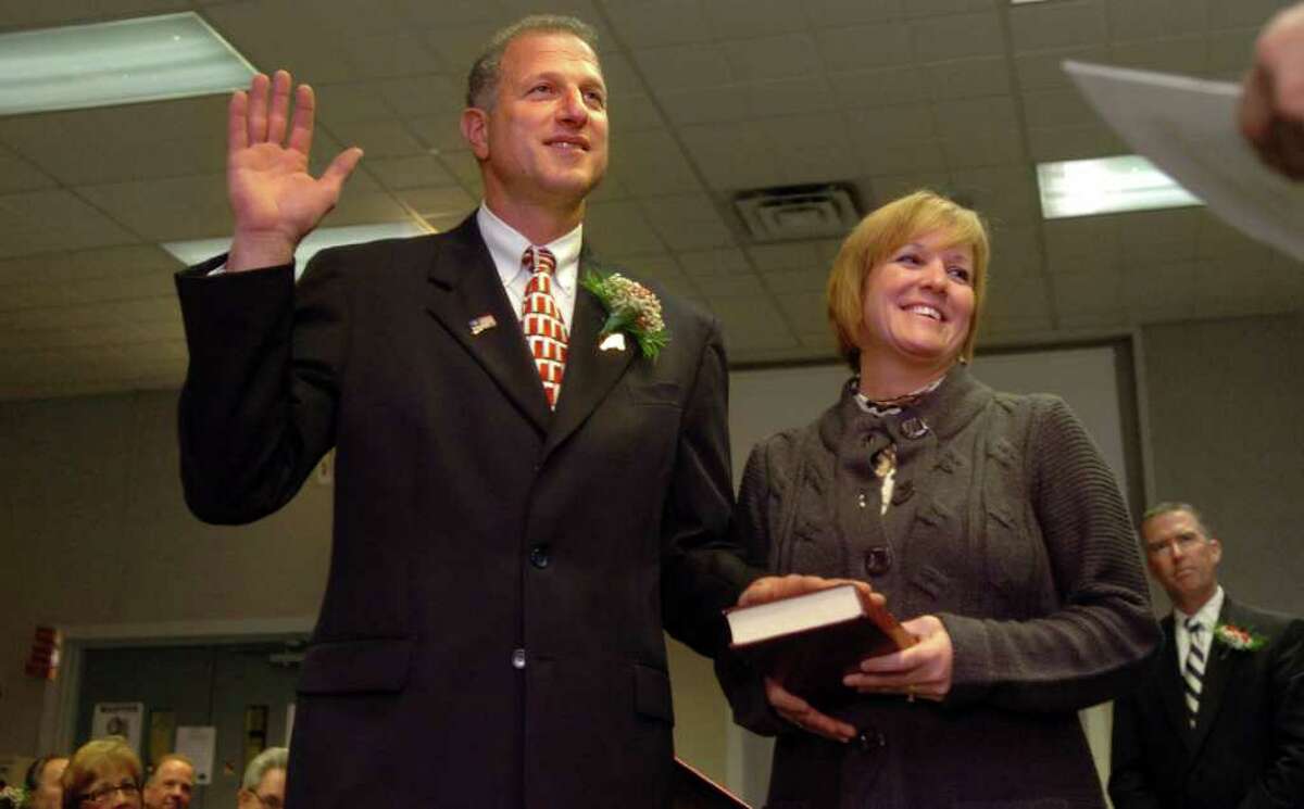Mayor Mark A. Lauretti, with wife Anndee, is sworn into a tenth term in office Nov. 18th, 2009 during Shelton's Inauguration Ceremony for elected officials at City Hall.