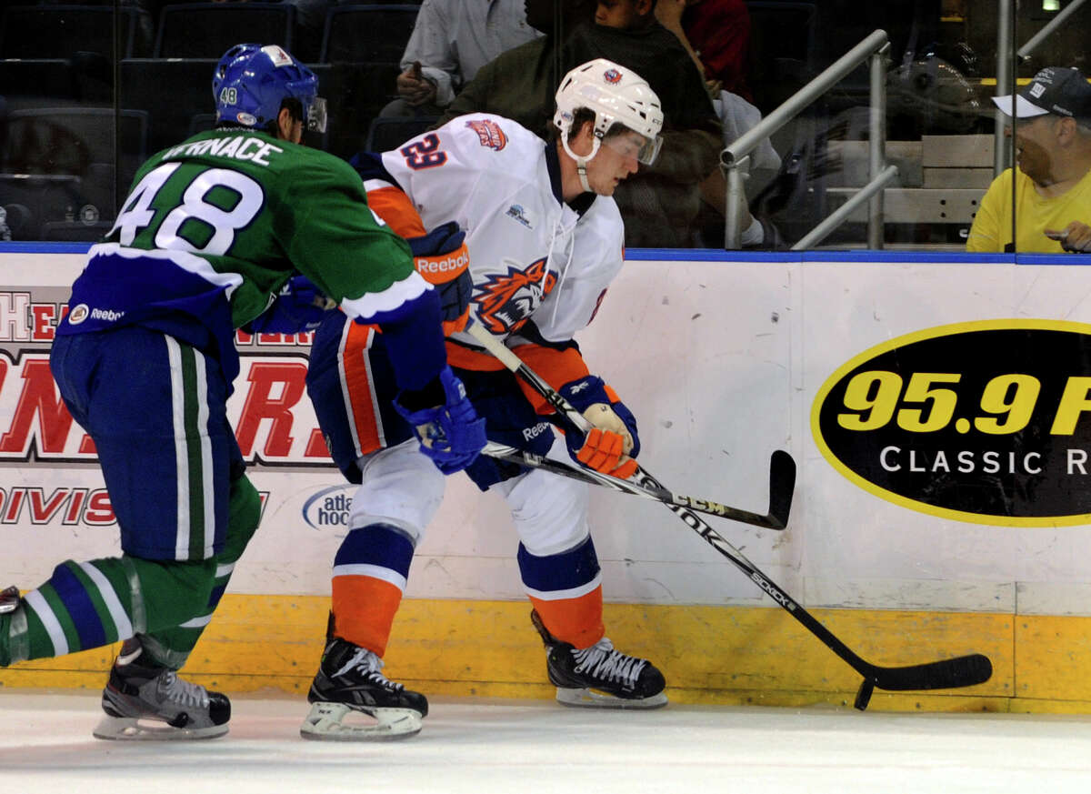 Sound Tigers #29 Brock Nelson moves the puck as Connecticut Whale's #48 Mike Vernace comes in to intercept, during hockey action at the Webster Bank Arena in Bridgeport, Conn. on Saturday April 21, 2012.