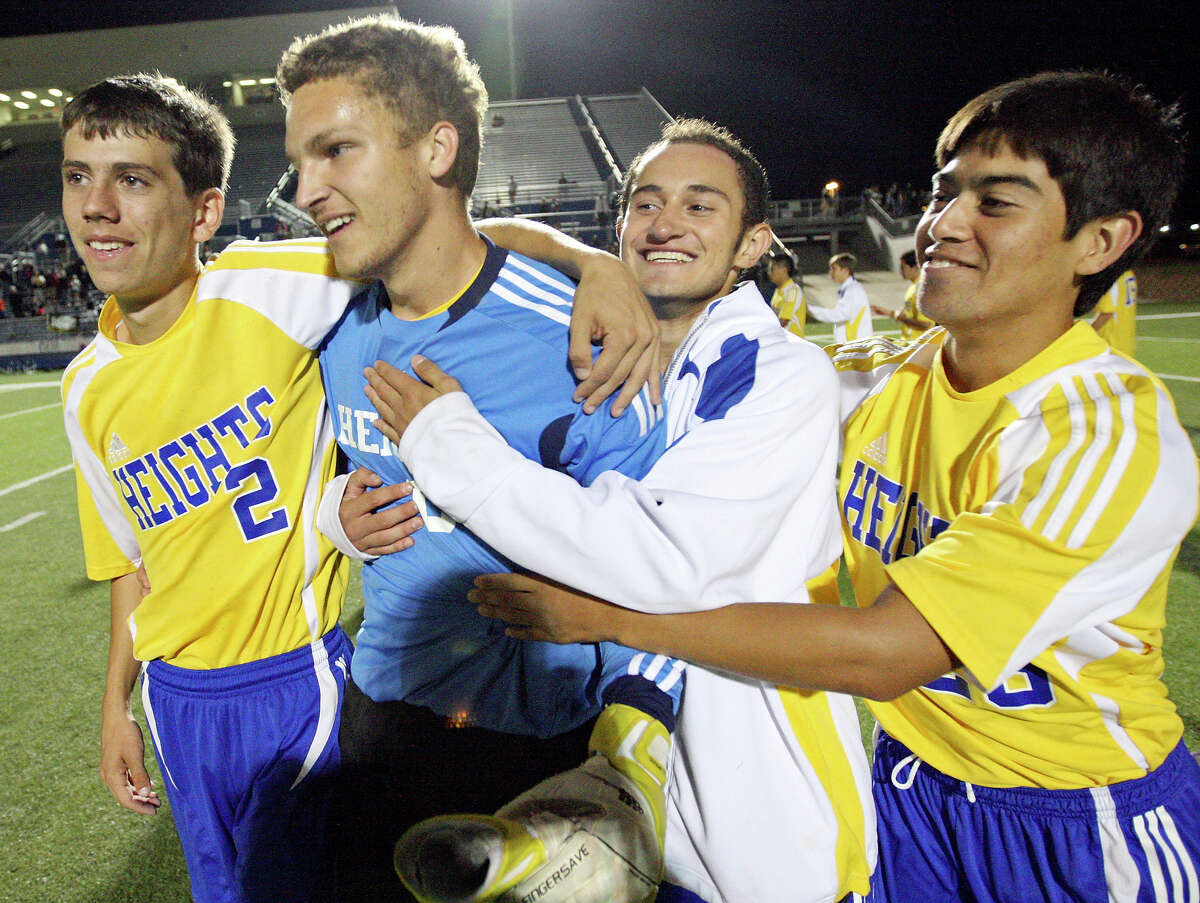 Alamo Heights' Joey Ortega (from left) and teammates Zack Jones, Arturo Espin. and Michael Ellis celebrate their win over Wichita Falls Rider in the Class 4A state final game Saturday April 21, 2012 at Birkelbach Field in Georgetown. Alamo Heights won 3-2 in a shootout.