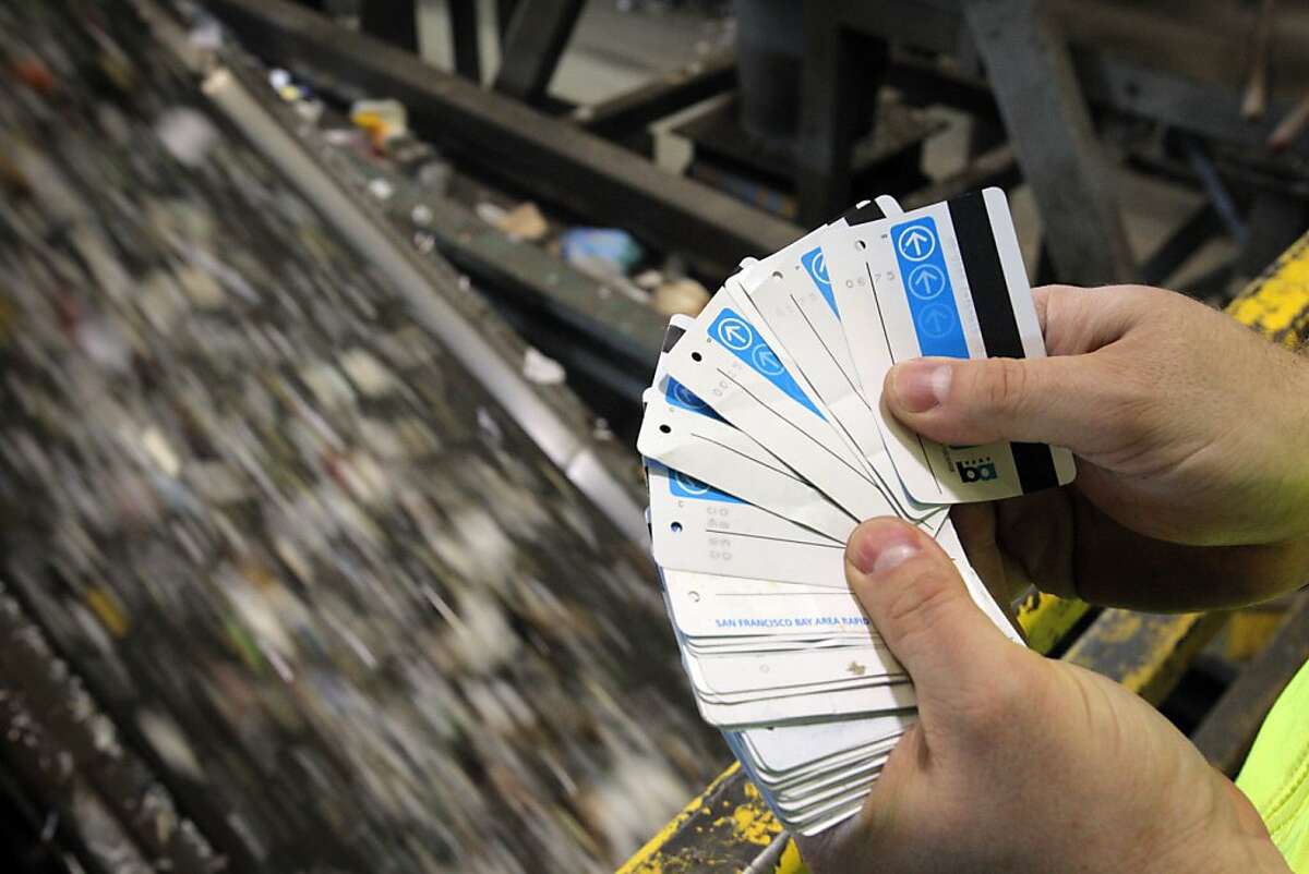 Recology's David Nanney holds recovered BART tickets by a sorting conveyer belt at the company's facility in San Francsico, Calif., on Tuesday, April 17, 2012. Last fall, Nanney and other Recology workers began plucking BART tickets out of the unrecyclable bits bound for the landfill, and donating them to the Tiny Tickets program, which allows charities to cash in the tickets. In four months, they raised $1,400, which they donated to the San Francisco Food Bank. Now Recology is planning to extend that effort, allowing people to tape unused BART tickets to trash bin lids, so collectors can gather and collect them, splitting the proceeds between the Food Bank and Friends of the Urban Forest.