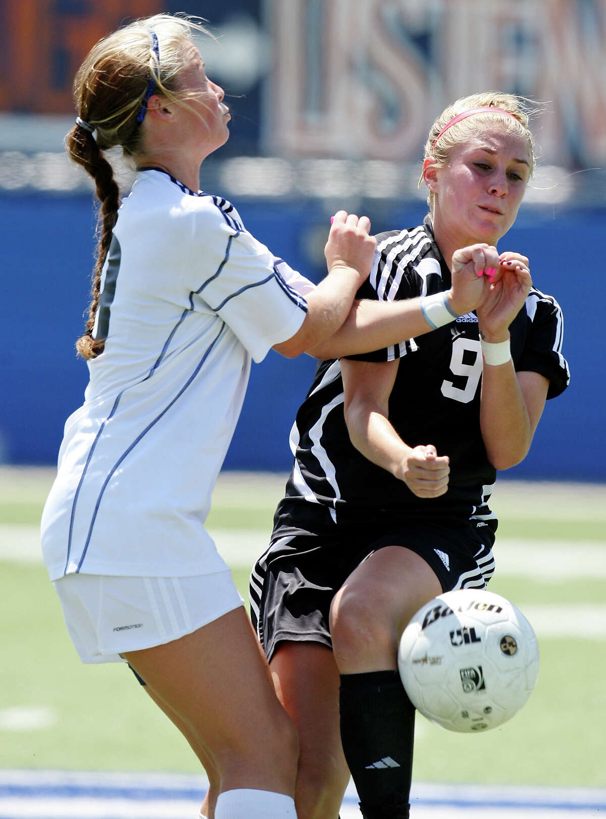 Katy Seven Lakes’ Shayne Clewitt (left) and Churchill’s Lauren Peck struggle for ball control in overtime action of their Class 5A state semifinal game April 19 at Birkelbach Field in Georgetown.