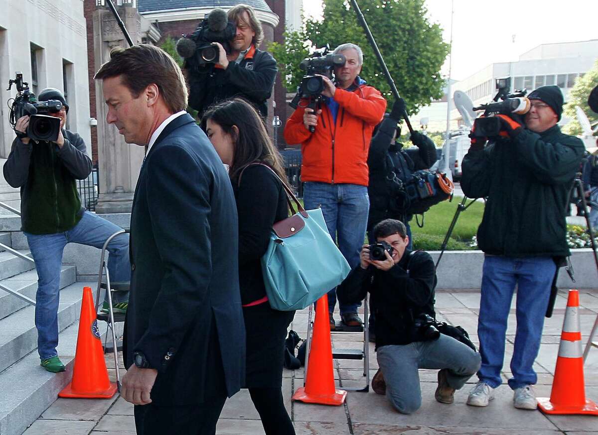 Former presidential hopeful John Edwards and daughter Cate Edwards Upham arrive at federal court in Greensboro, N.C., on Monday.