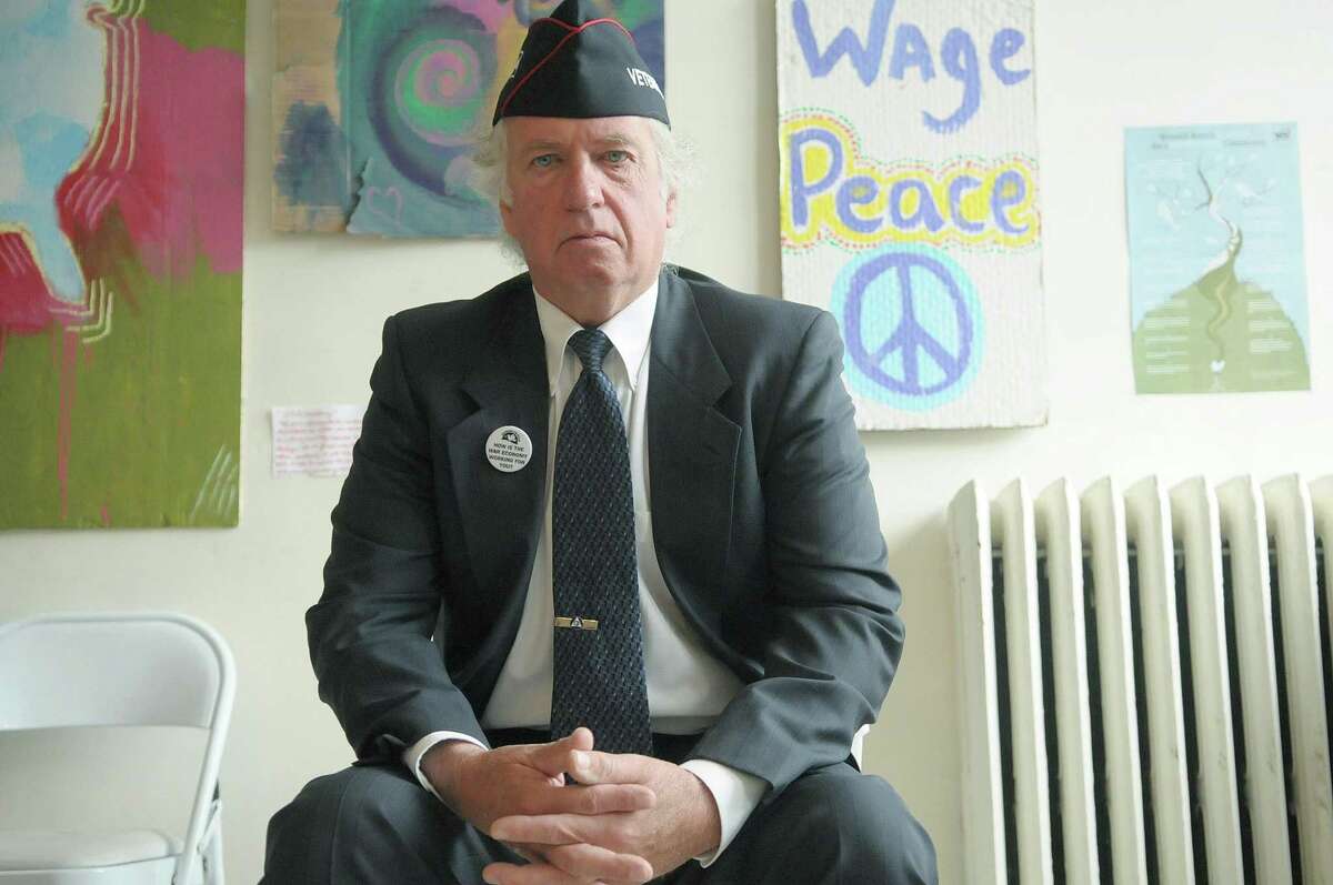 Marine Corps Veteran John Amidon, president of the local chapter of Veterans for Peace, poses for a photograph during an interview on Monday, April 23, 2012 in Albany, NY. Amidon was arrested on Sunday with others as they were marching towards Hancock Field in Syracuse, NY. (Paul Buckowski / Times Union)