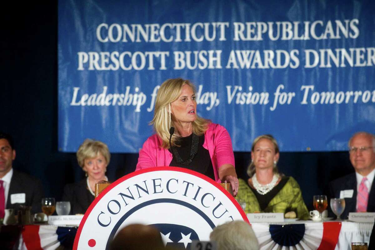 Ann Romney, wife of presumptive GOP presidential nominee Mitt Romney, keynotes the Prescott Bush Award dinner at the Stamford Marriott Hotel & Spa in Stamford, Conn., April 23, 2012. Senate hopeful Linda McMahon, left, Icy Frantz and Senate hopeful Chris Shays listen to Romney during the event, which is the biggest fundraiser of the year for the state GOP. Foley received the the Bush award and state Rep. Lile Gibbons, R-150th District, also received an award during the ceremony.