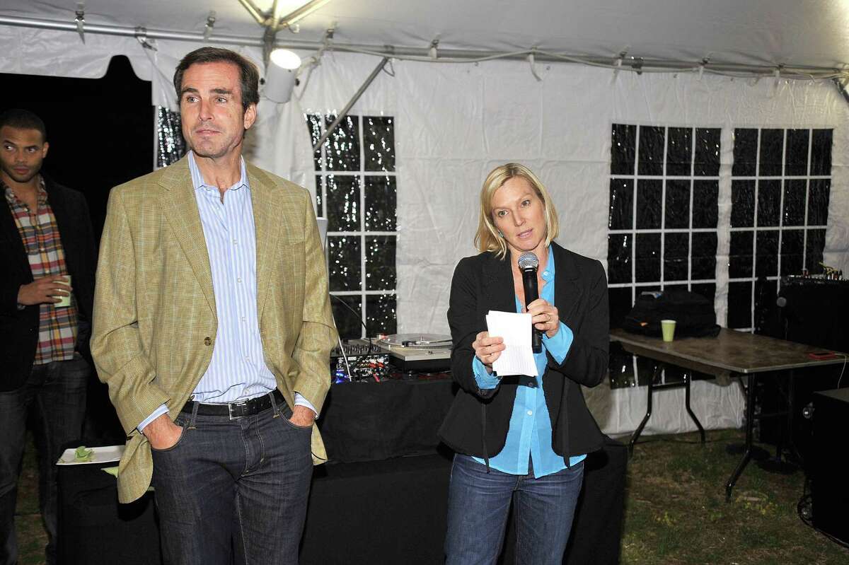 Bob Woodruff (L) looks on as Lee Woodruff speaks at the Bob Woodruff Foundation's "Celebrate Spring in Connecticut" on April 21, 2012 in Stamford, Connecticut.