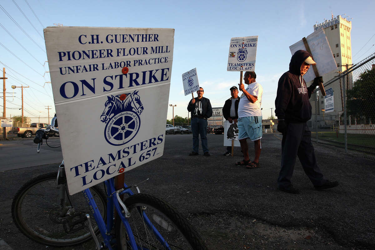 Striking employees gather near the entrance of C.H. Guenther & Son mill near South Alamo and Probandt streets.