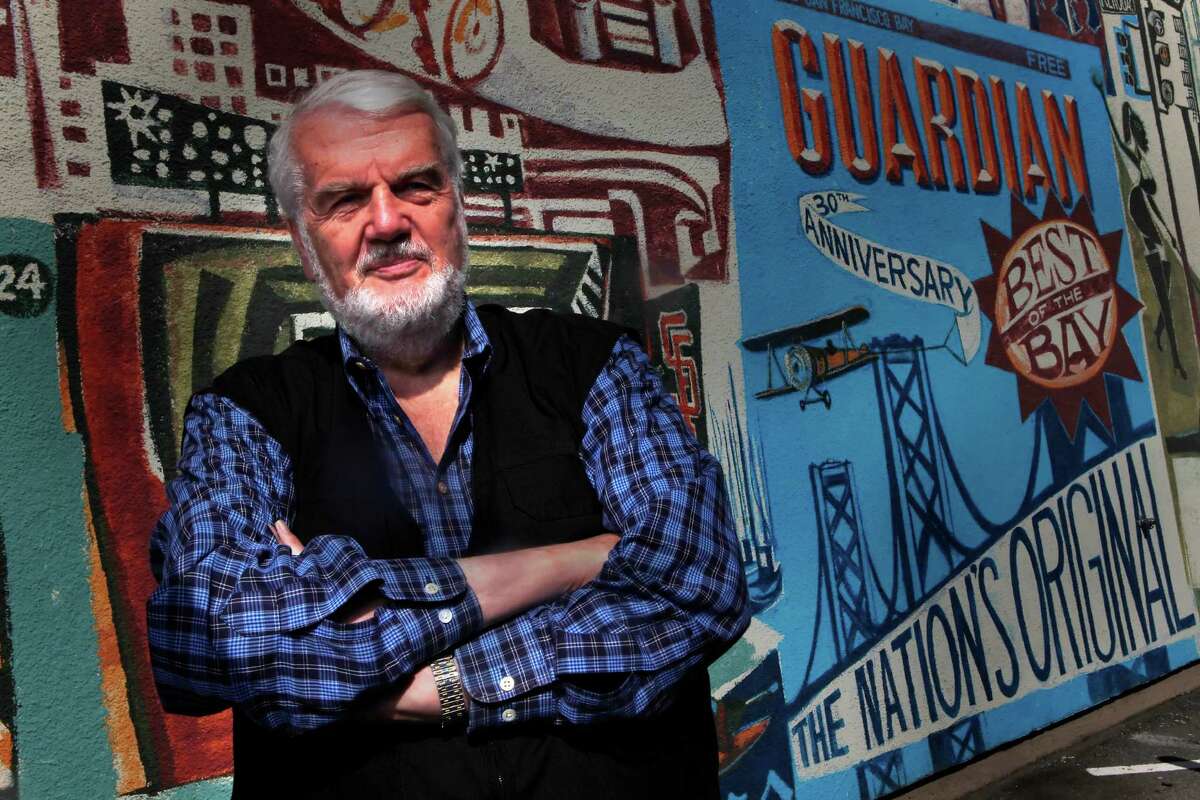 Bruce Brugmann, owner of the Bay Guardian, is seen in front of a mural at the Bay Guardian offices on Friday, October 15, 2010 in San Francisco, Calif.
