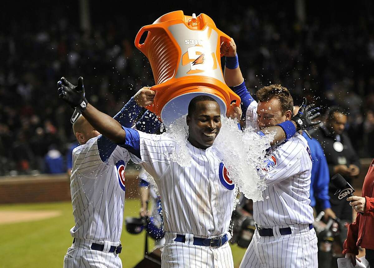 Chicago Cubs left fielder Alfonso Soriano (12) hits a single to