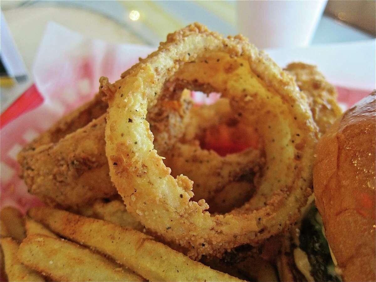 The onion rings, battered and fried in house, are stupendous specimens, thick-cut and juicy enough to stand up to their crackly golden crusts.