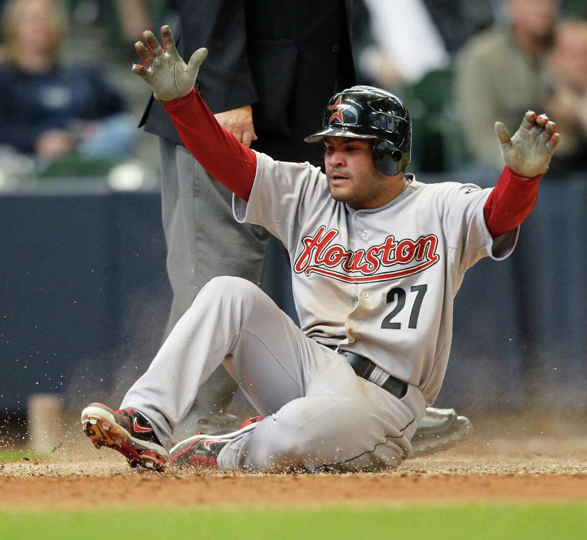 Houston Astros' Jose Altuve scores on an RBI single by the Astros' J.D. Martinez during the eighth inning of a baseball game against the Milwaukee Brewers, Wednesday, April 25, 2012, in Milwaukee. (AP Photo/Jeffrey Phelps)