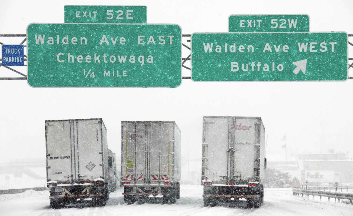 Vehicles sit stranded on the New York State Thruway during a winter storm in Buffalo, N.Y., Thursday, Dec. 2, 2010.