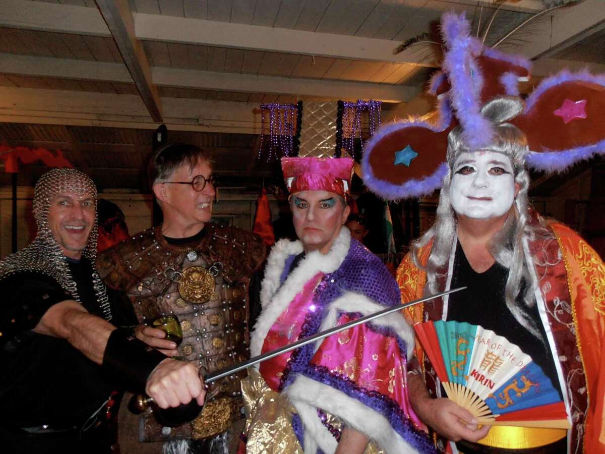Randy Caddell, from left, Dwight Hobart, Arturo Almeida and Alan Beckstead get into character before the back yard production of “Turandot” to benefit the Artists Foundation.