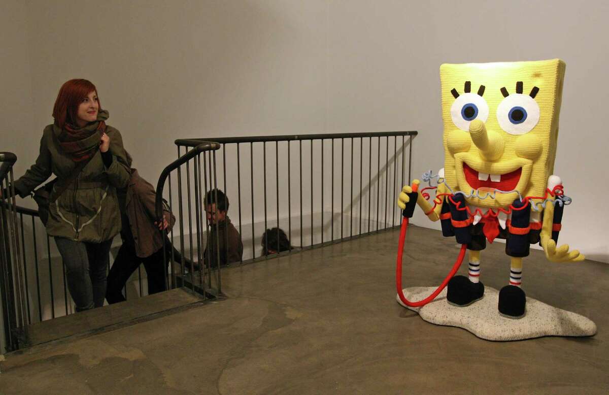 The knitted sculpture "Spongebob" by Patricia Waller, featuring the cartoon character as a suicide bomber, stands in the "Broken Heroes" exhibition at the Deschler Gallery on April 26, 2012 in Berlin, Germany. The exhibition of hand-crocheted comic, puppet and cartoon figures shows icons of pop culture in various unfortunate states.