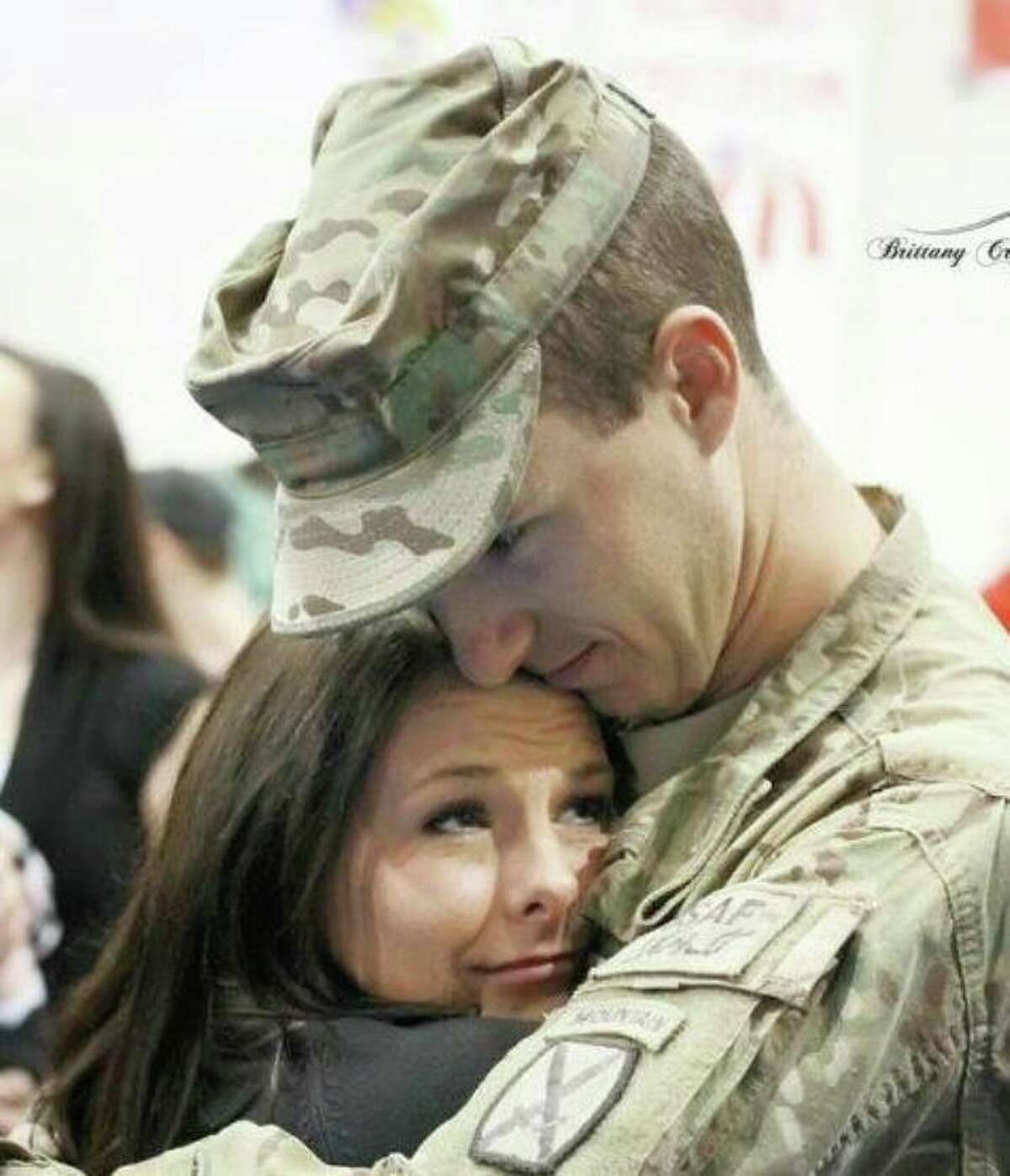 Sgt. M. Joshua Laughery embraces his wife Ashley when he returned from Afghanistan.