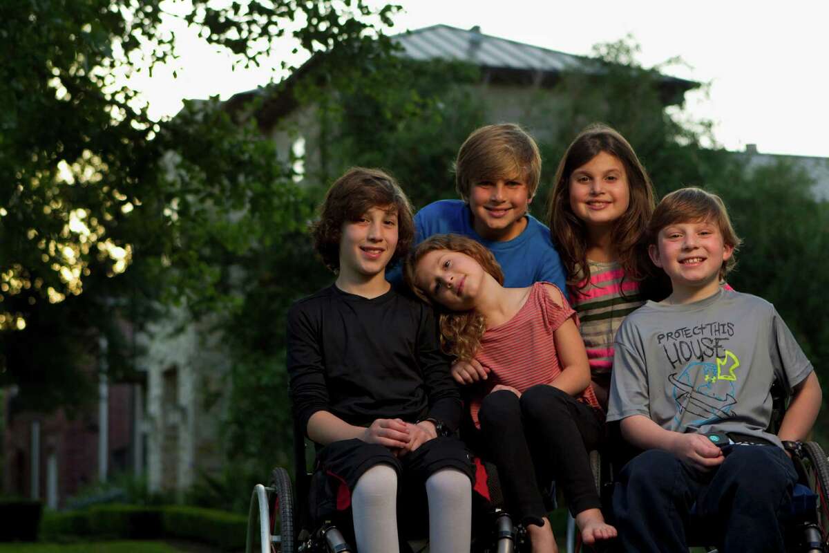 Peter, 10, Willa, 6, and Aaron Berry, 9, spend time with their cousins, Noah, 10, Misha, 9, back. the Berry kids live with their cousins in Bellaire. Peter, Willa and Aaron survived the car accident that killed their father and mother, Josh and Robin Berry, on July 2, 2011, in West Texas while on their way back from a family vacation in Colorado. The accident resulted in spinal cord injuries to their two sons, leaving them unable to walk, and Willa, 6, less seriously injured and recovered. The driver of the other vehicle, Michael Scott Doyle, who caused the accident by crossing into the oncoming lane wile reaching for a DVD in his SUV, survived, along with his 1-year-old daughter. His wife, Colleen, 28, also died in the accident.