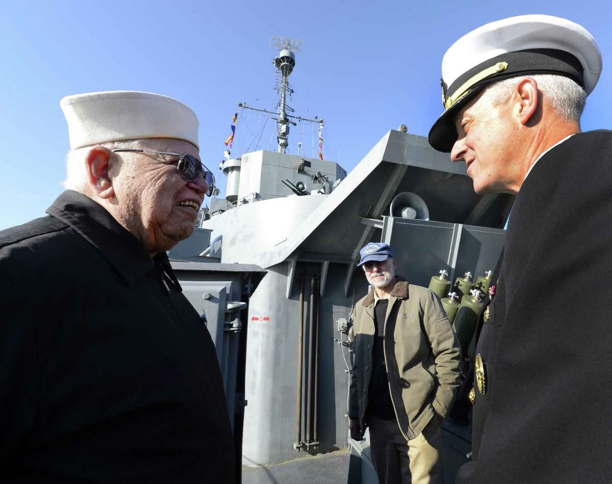 Bill Scharoun, left greets Rear Admiral David Titley as he starts his visit to the Capital Region for a tour of the USS Slater in Albany on April 26, 2012. (Skip Dickstein/Times Union)