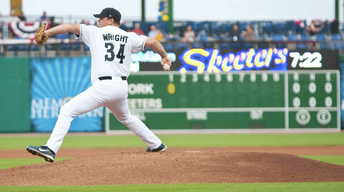 Sugar Land Skeeter starting pitcher Matt Wright throws out the first pitch in Skeeters history during the inaugural game, Thursday, April 26, 2012, at Constellation Field in Houston.