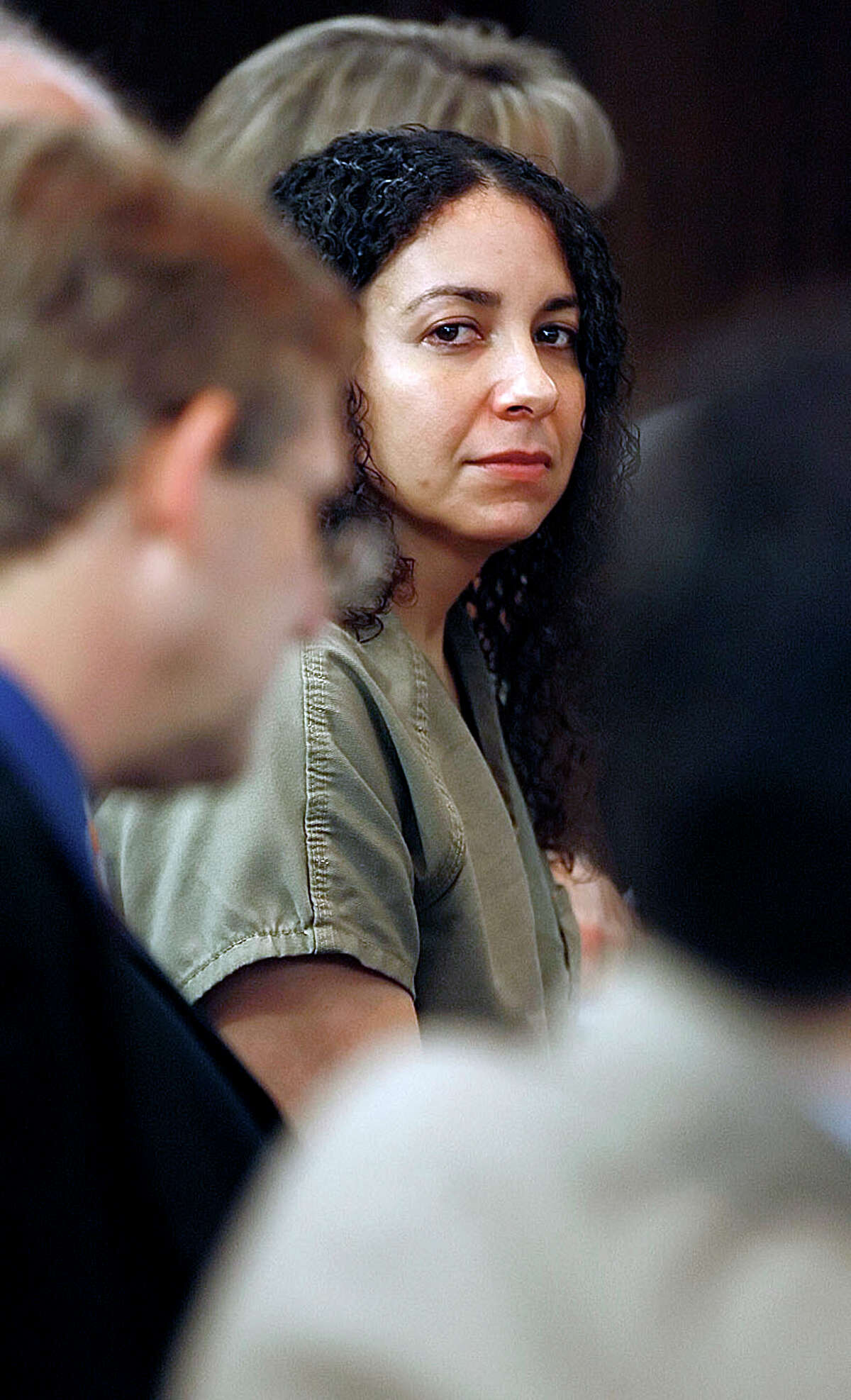 Hannah Overton takes her seat for the second day of her appeals case Tuesday, April 24, 2012 at the Nueces Courthouse in Corpus Christi, Texas. Overton was Convicted of capital murder in 2007 in connection with the death of her foster child, Andrew Burd.(AP Photo/Corpus Christi Caller-Times, Todd Yates) MANDATORY CREDIT ; TV OUT; MAGS OUT