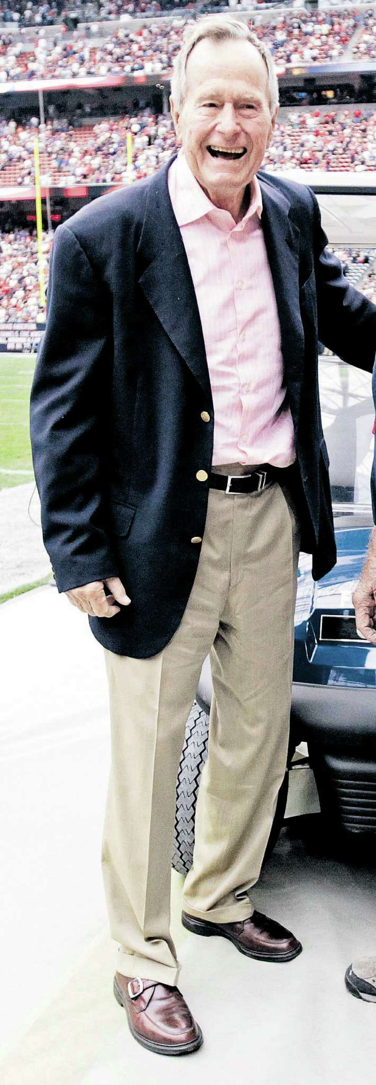 President George H.W. Bush, shown before a 2010 Texans game.