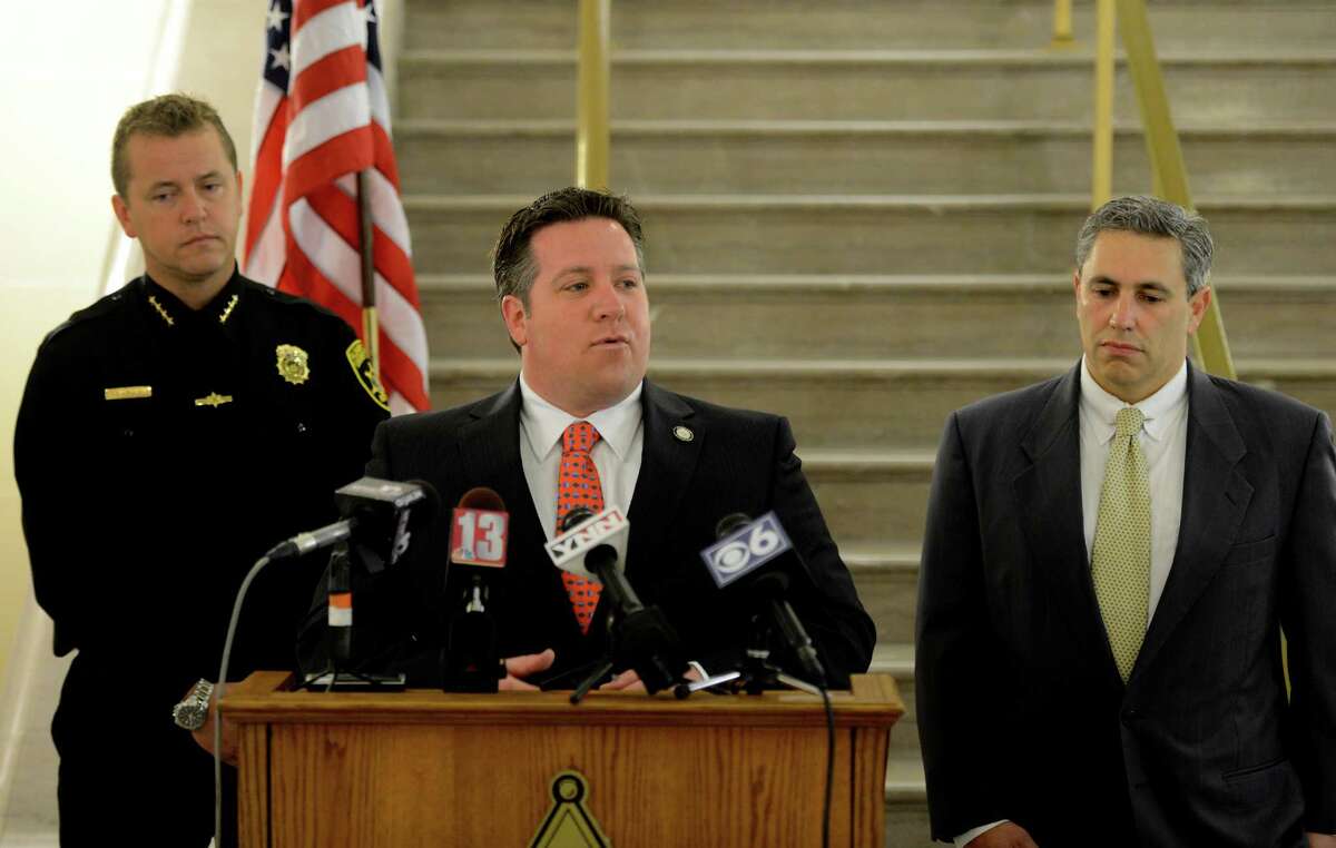 Albany County Executive Dan McCoy announced the results of a sting operation held yesterday afternoon at a local "Cash For Gold" store in Albany, N.Y during a press conference held at the Albany County Courthouse April 27, 2012. McCoy is joined by Albany County Sheriff Craig Apple, left and Albany County Attorney Thomas Marcelle, right. (Skip Dickstein / Times Union archive)