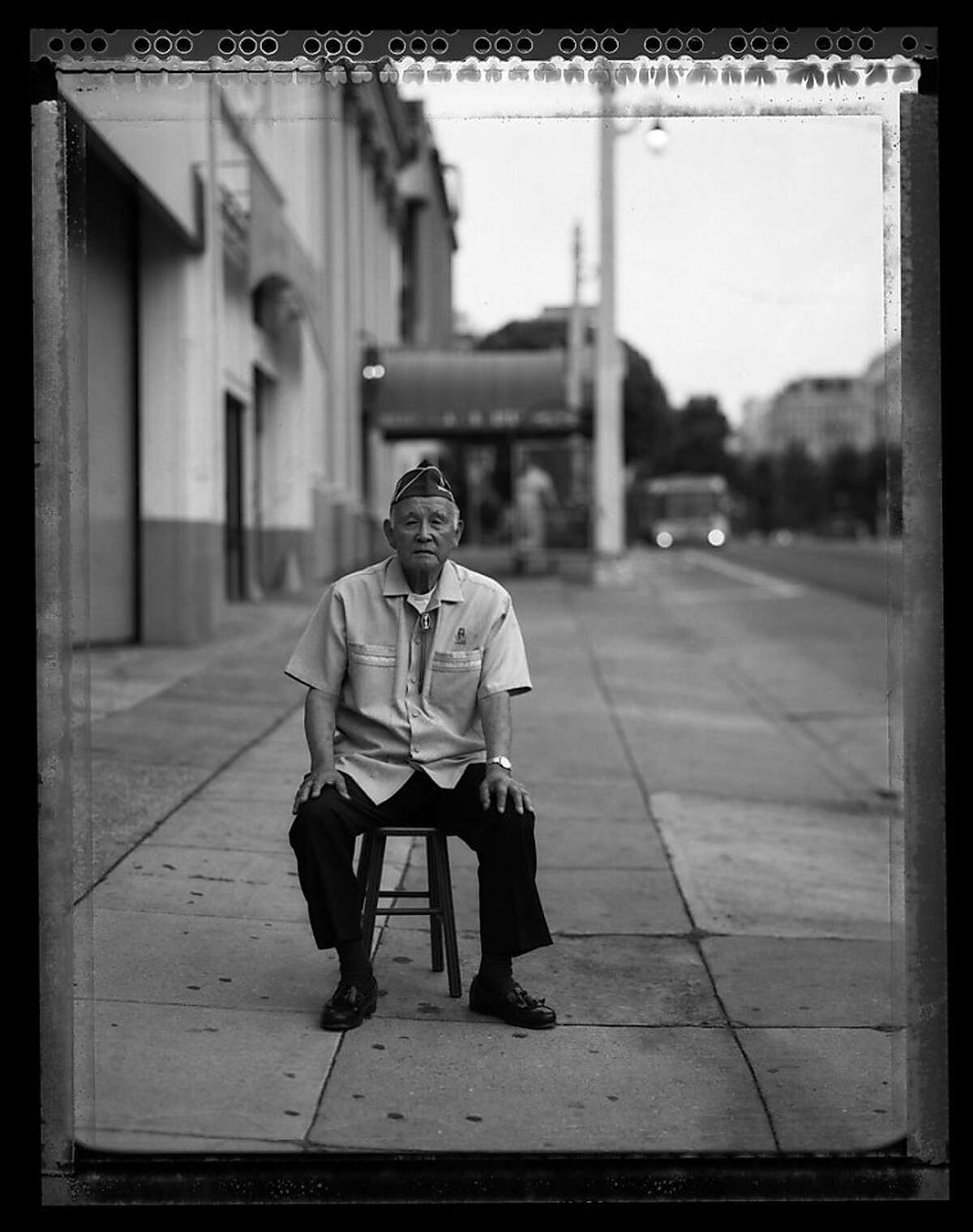 Mitsunobu ÒMitsÓ Kojimoto, 85, sits in outside the building on Van Ness Street in San Francisco July 11, 2008 where he waited for a bus to take him to the SantaAnita Assembly Center. At age 19, Kojimoto volunteered for the U.S. Army and joined the 442nd Regimental Combat Team, H company. He received the Bronze Star for his service in France and Italy.