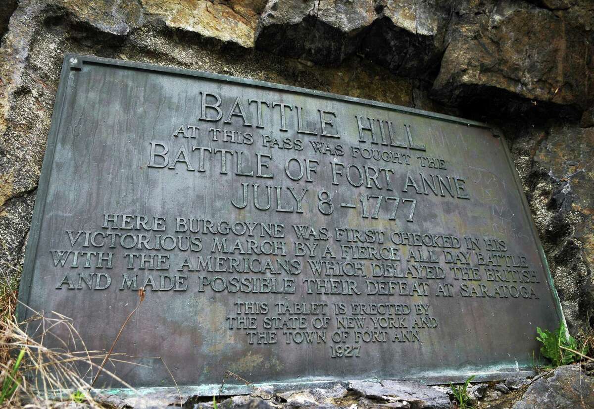 A 1927 historic marker embedded in the rock face of Battle Hill along Route 4 in Fort Ann, where the British and American forces clashed just before the Battle of Saratoga in 1777. The historic battlefield was purchased by a private developer, who has applied to mine a stone quarry on the site. (John Carl D'Annibale / Times Union)