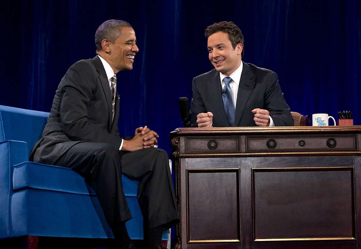 President Barack Obama talks with Jimmy Fallon during commercial break as he participates in a taping of the Jimmy Fallon Show, Tuesday, April 24, 2012, at the University of North Carolina at Chapel Hill, N.C..