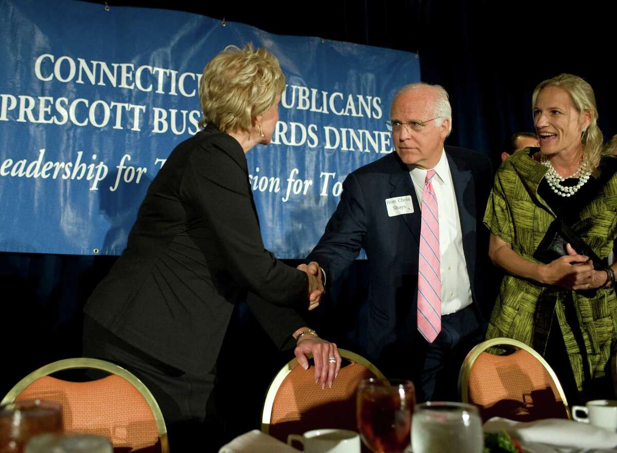 Republican U.S. Senate candidates Linda McMahon, left, and Chris Shays, right, shake hands at the Connecuticut GOP Prescott Bush Awards dinner in Stamford, Conn., Monday, April 23, 2012.Ann Romney told the packed crowd she believes her husband Mitt Romney has the right message to win the Democratic leaning state. (AP Photo/Jessica Hill)