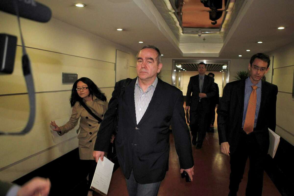 The top U.S. diplomat for East Asia, Kurt Campbell, front, arrives at a hotel in Beijing, China, in the early morning of Sunday, April 29, 2012. Campbell arrived in China apparently to deal with the case of blind legal activist Chen Guangcheng who escaped house arrest in his Chinese village and is reportedly under the protection of American officials. Fellow activists say Chen Guangcheng, a blind lawyer who exposed forced abortions and sterilizations as part of China's one-child policy, fled house arrest a week ago and has sought protection at the U.S. Embassy in Beijing.