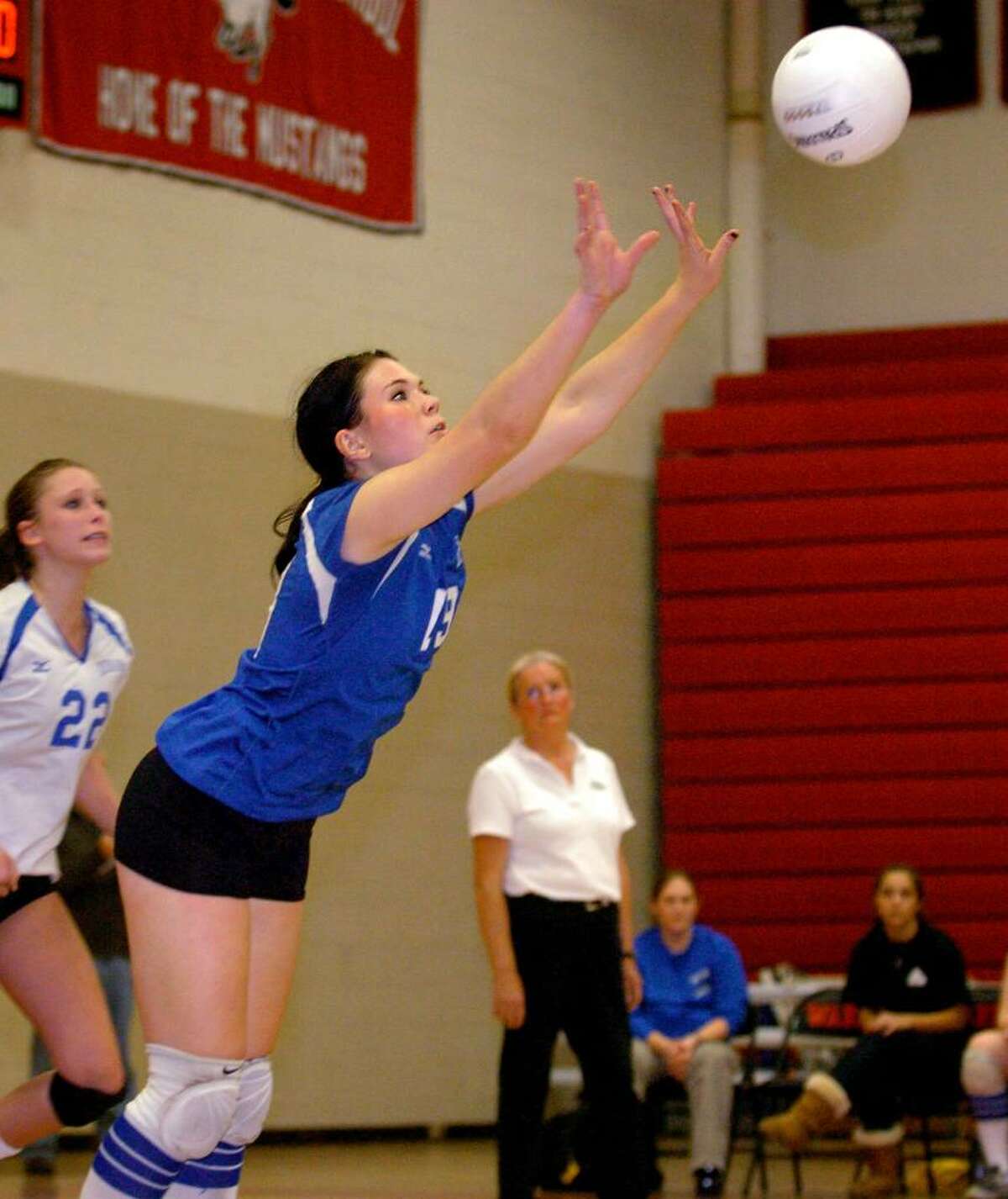 Fairfield Ludlowe's Madison McCaffery sets up the ball during the third set in Thursday night's Class LL semifinal match against Staples at Fairfield Warde High School.