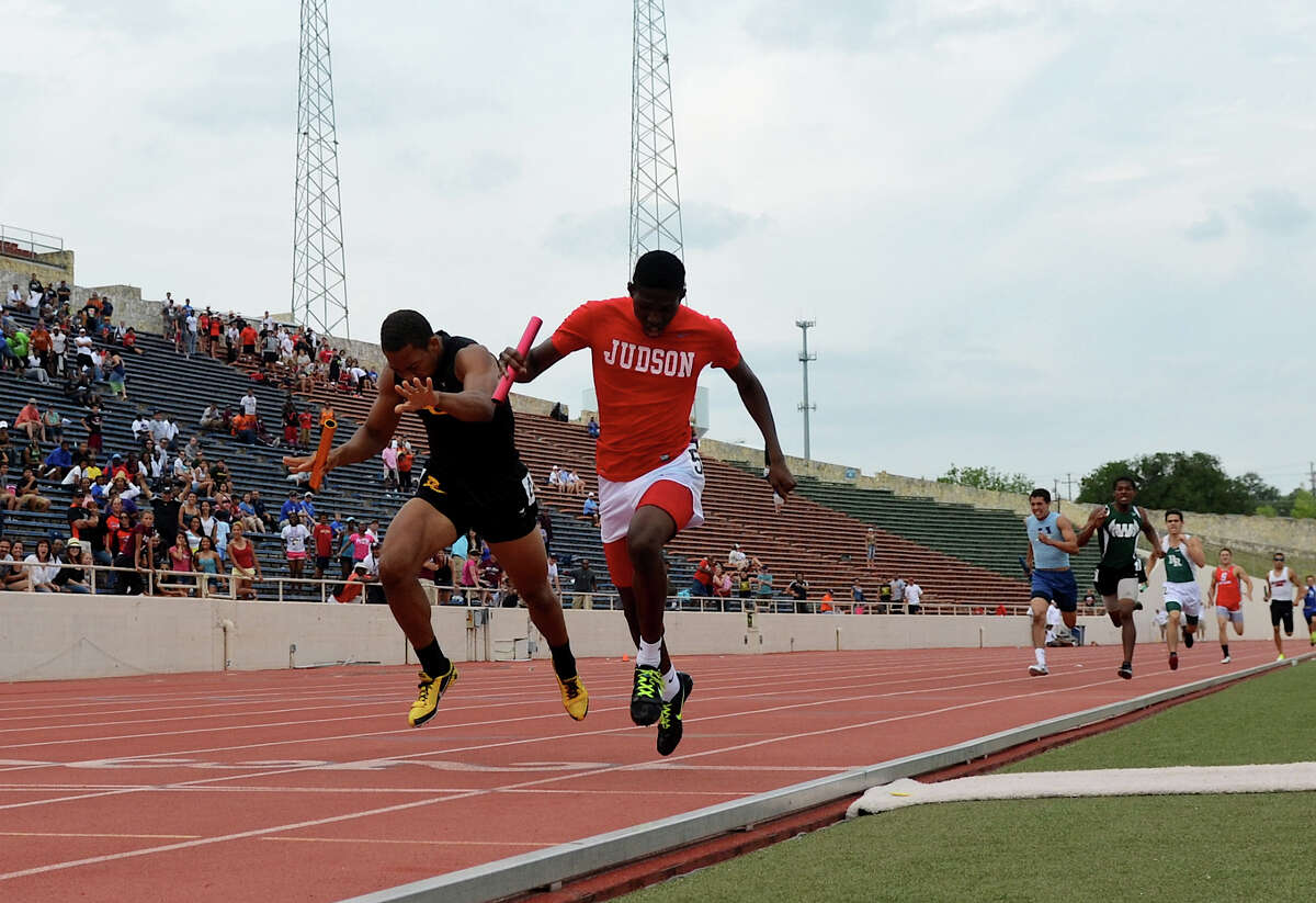 Judson's Jerome Gatewood (right) edges out East Central's Chris Armstrong (left) as they cross the finish line in the 5A boys 4x400 meter relay during the Region IV Track Meet on April 28, 2012 at Alamo Stadium in San Antonio Texas. John Albright / Special to the Express-News.