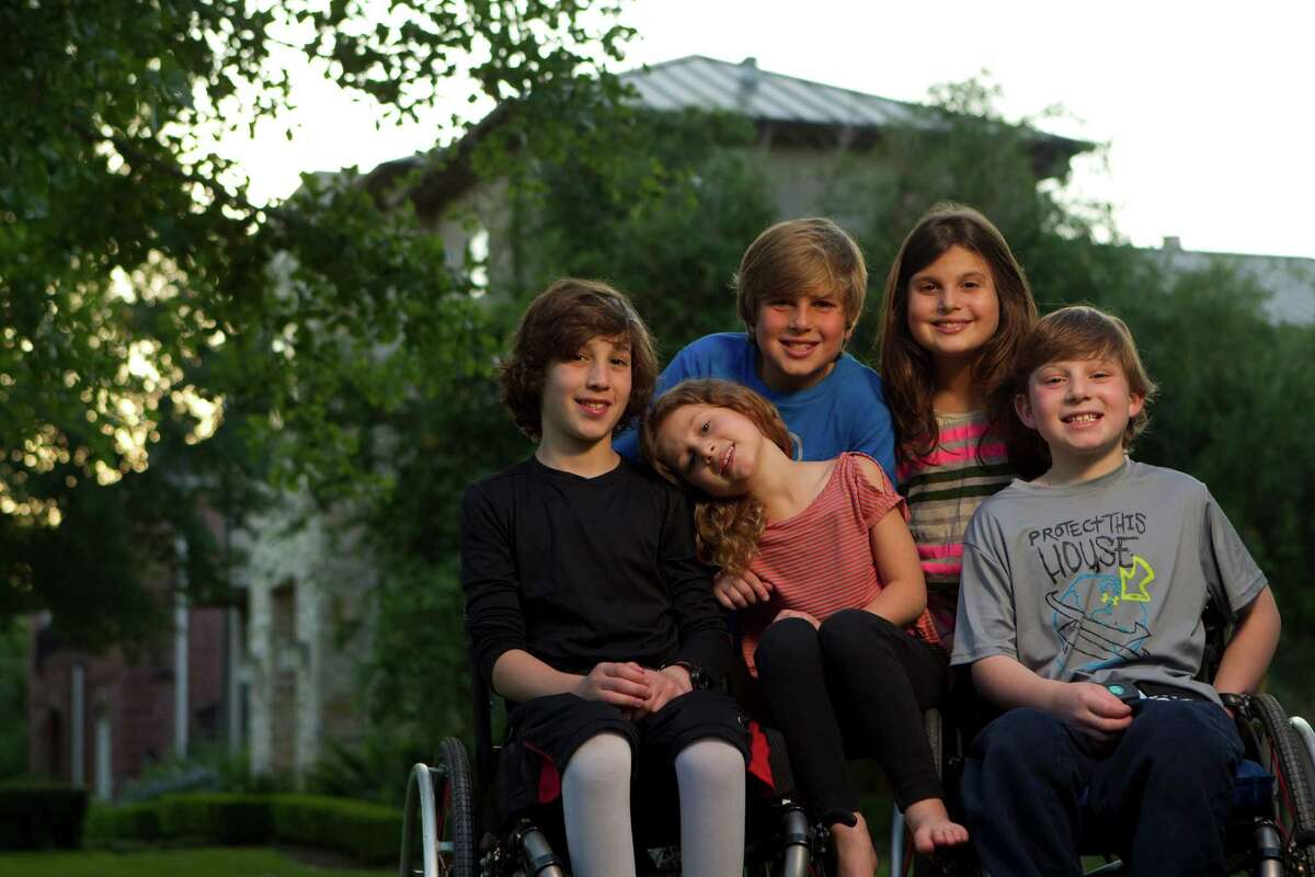 From left, Peter, 10, Willa, 6, Noah, 10, Misha, 9, and Aaron Berry, 9, outside their home Thursday, April 19, 2012, in Bellaire. Joshua and Robin Berry were killed in an automobile accident in west Texas on July 2, 2011 on their way back from a family vacation in Colorado.