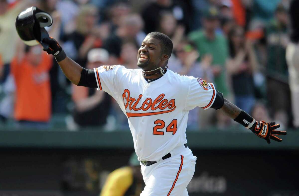 Baltimore's Wilson Betemit celebrates his game-winning three-run homer that lifted the Orioles past the Athletics 5-2.