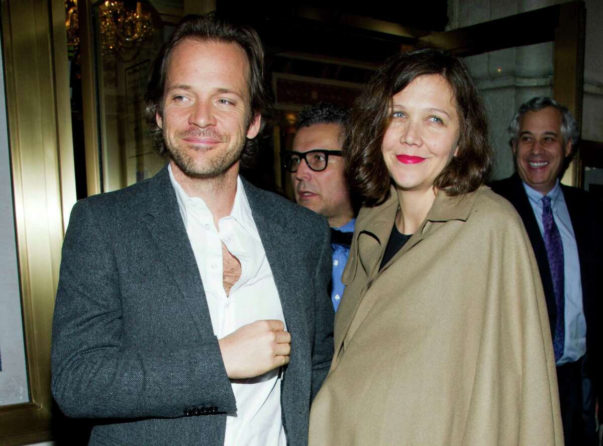 FILE - In this March 15, 2012 file photo, actors Peter Sarsgaard amd Maggie Gyllenhaal leave the opening night performance of the Broadway revival of Arthur Miller's "Death of a Salesman" in New York. Gyllenhaal?’s publicist said in an email Monday, April 30, 2012, that the actress gave birth to Gloria Ray on April 19 in New York. No more details were provided. The couple had their first daughter, Ramona, in 2006. They got married in 2009. (AP Photo/Charles Sykes, file)